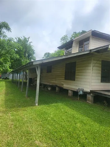 a view of a backyard with chairs