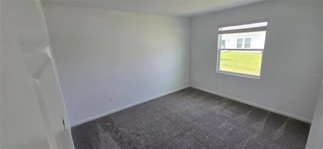 an empty room with a empty space and window