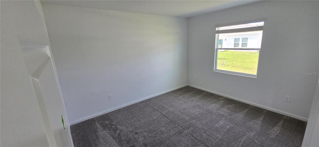 1029 Holden Way Eagle Lake, FL 33839 - Photo 12 of 22 an empty room with a window
