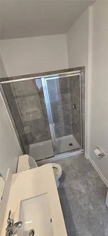 a bathroom with a bathtub and toilet
