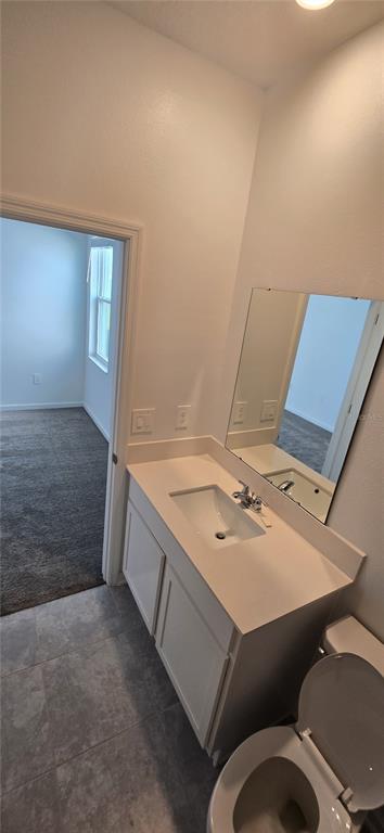 1029 Holden Way Eagle Lake, FL 33839 - Photo 17 of 22 a bathroom with a sink mirror vanity and toilet