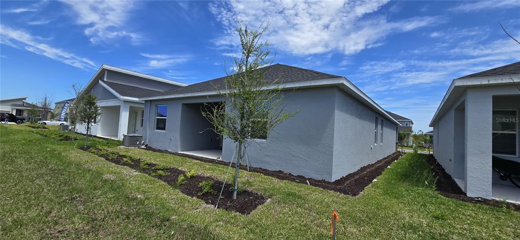 1029 Holden Way Eagle Lake, FL 33839 - Photo 22 of 22 a backyard of a house with lots of green space