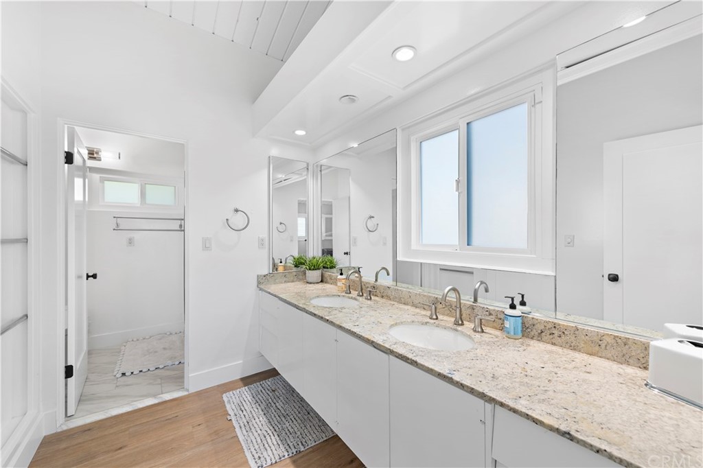 317 Monarch Bay Drive Dana Point, CA 92629 - Photo 12 of 26 a bathroom with a granite countertop sink mirror and double