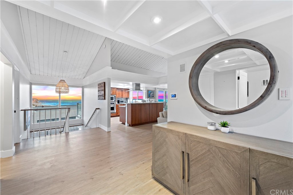 317 Monarch Bay Drive Dana Point, CA 92629 - Photo 13 of 26 an entryway with wooden floor and mirror