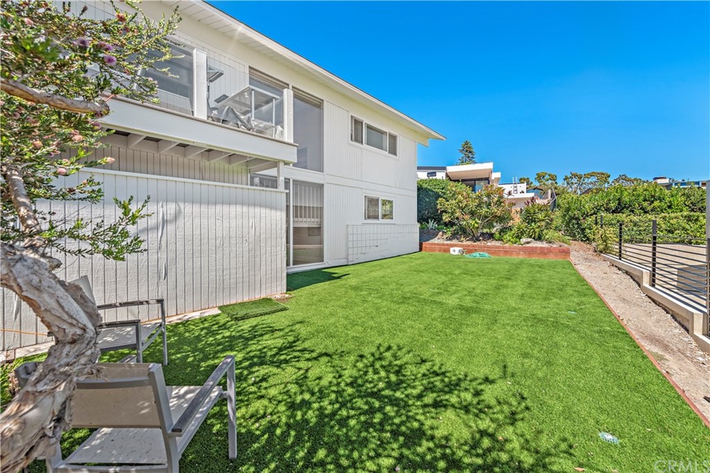 317 Monarch Bay Drive Dana Point, CA 92629 - Photo 17 of 26 a view of a house with a yard and potted plants
