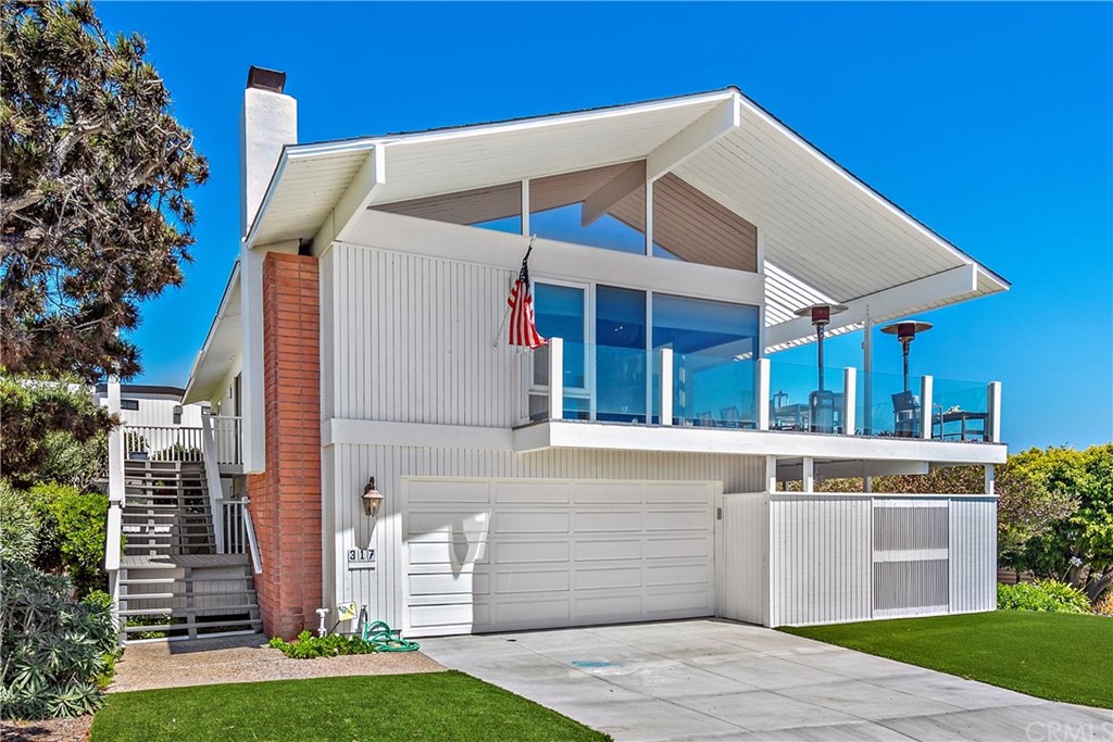 317 Monarch Bay Drive Dana Point, CA 92629 - Photo 2 of 26 a front view of a house with a yard
