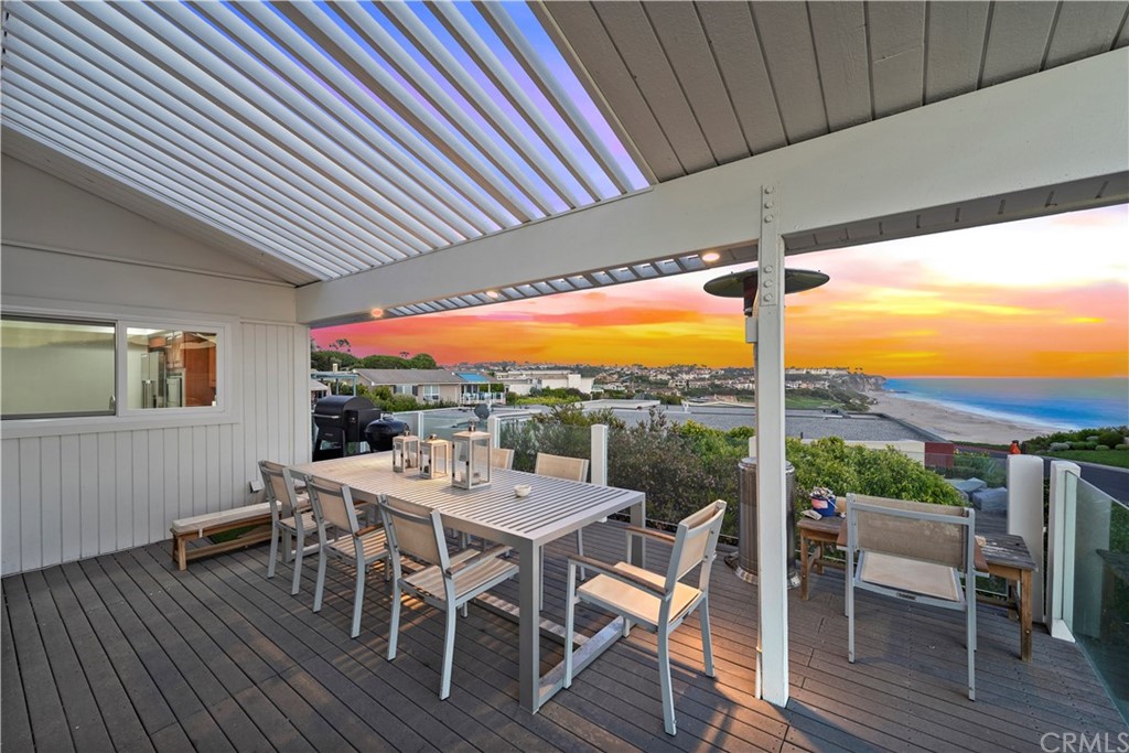 317 Monarch Bay Drive Dana Point, CA 92629 - Photo 21 of 26 a view of a patio with a table chairs and backyard