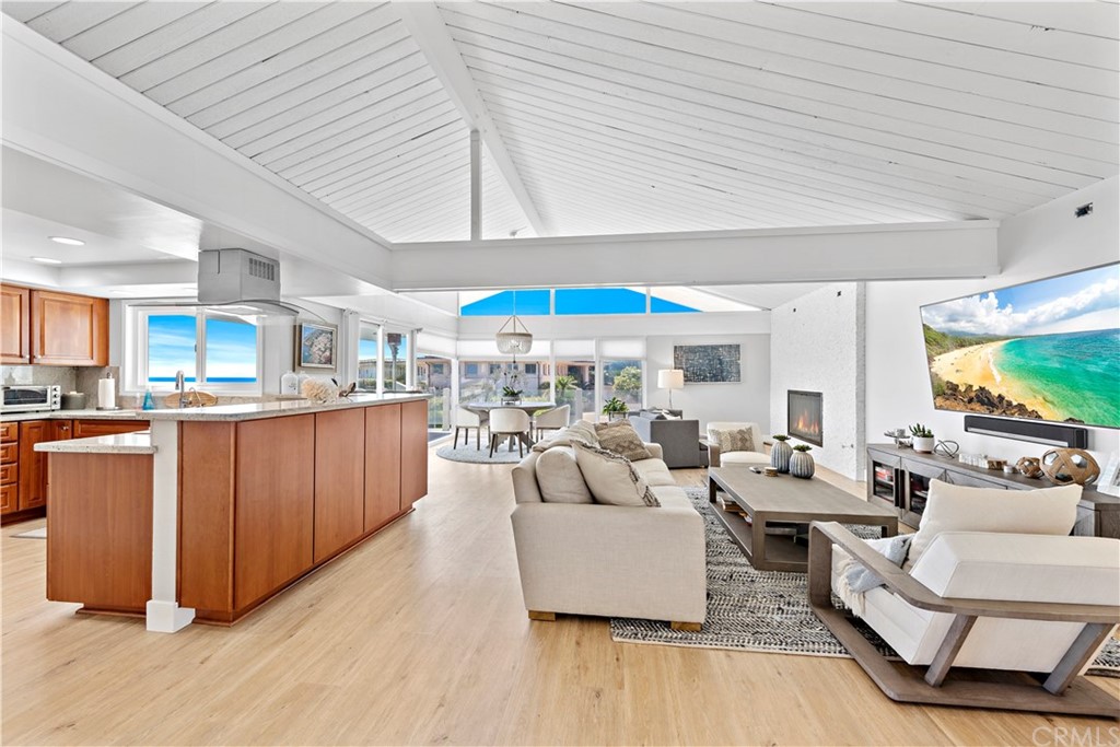 317 Monarch Bay Drive Dana Point, CA 92629 - Photo 6 of 26 a living room with furniture and a flat screen tv