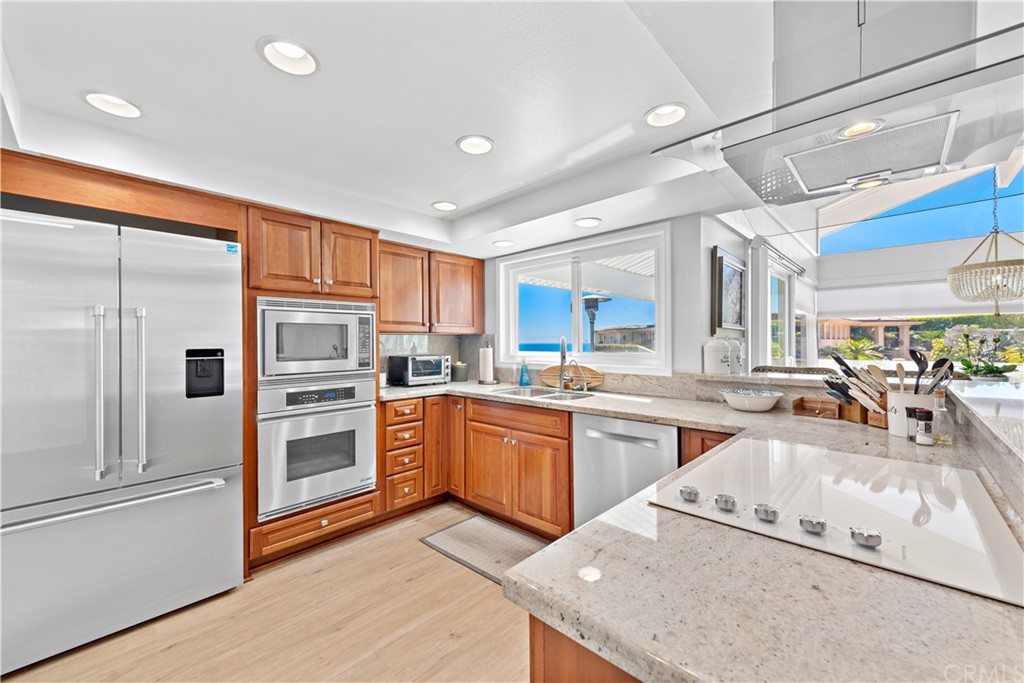 317 Monarch Bay Drive Dana Point, CA 92629 - Photo 9 of 26 a kitchen with stainless steel appliances granite countertop a refrigerator and a stove top oven
