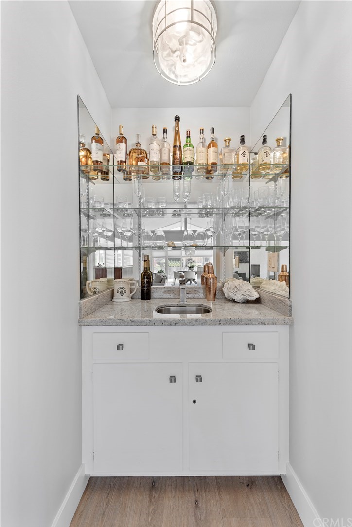 317 Monarch Bay Drive Dana Point, CA 92629 - Photo 10 of 26 a room with lots of bottles of alcohol