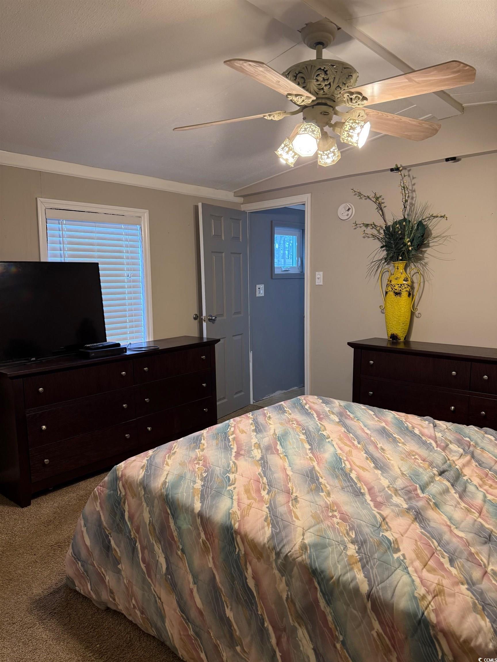 2709 Orion Drive Myrtle Beach, SC 29575 - Photo 19 of 27 Carpeted bedroom featuring a ceiling fan and ornamental molding