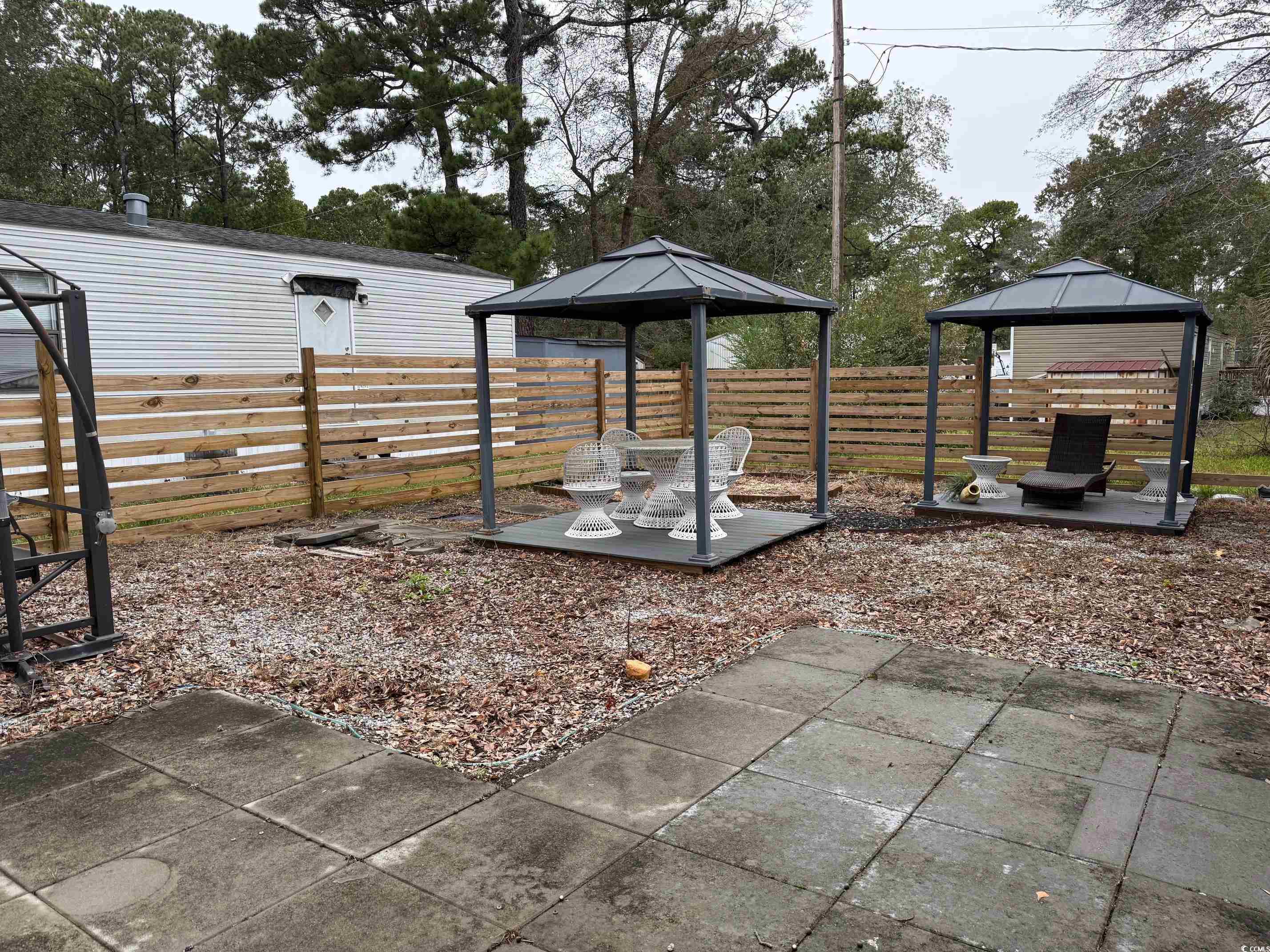 2709 Orion Drive Myrtle Beach, SC 29575 - Photo 9 of 27 View of yard featuring a gazebo and a patio