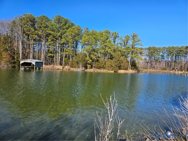 a view of a lake with a building in the background