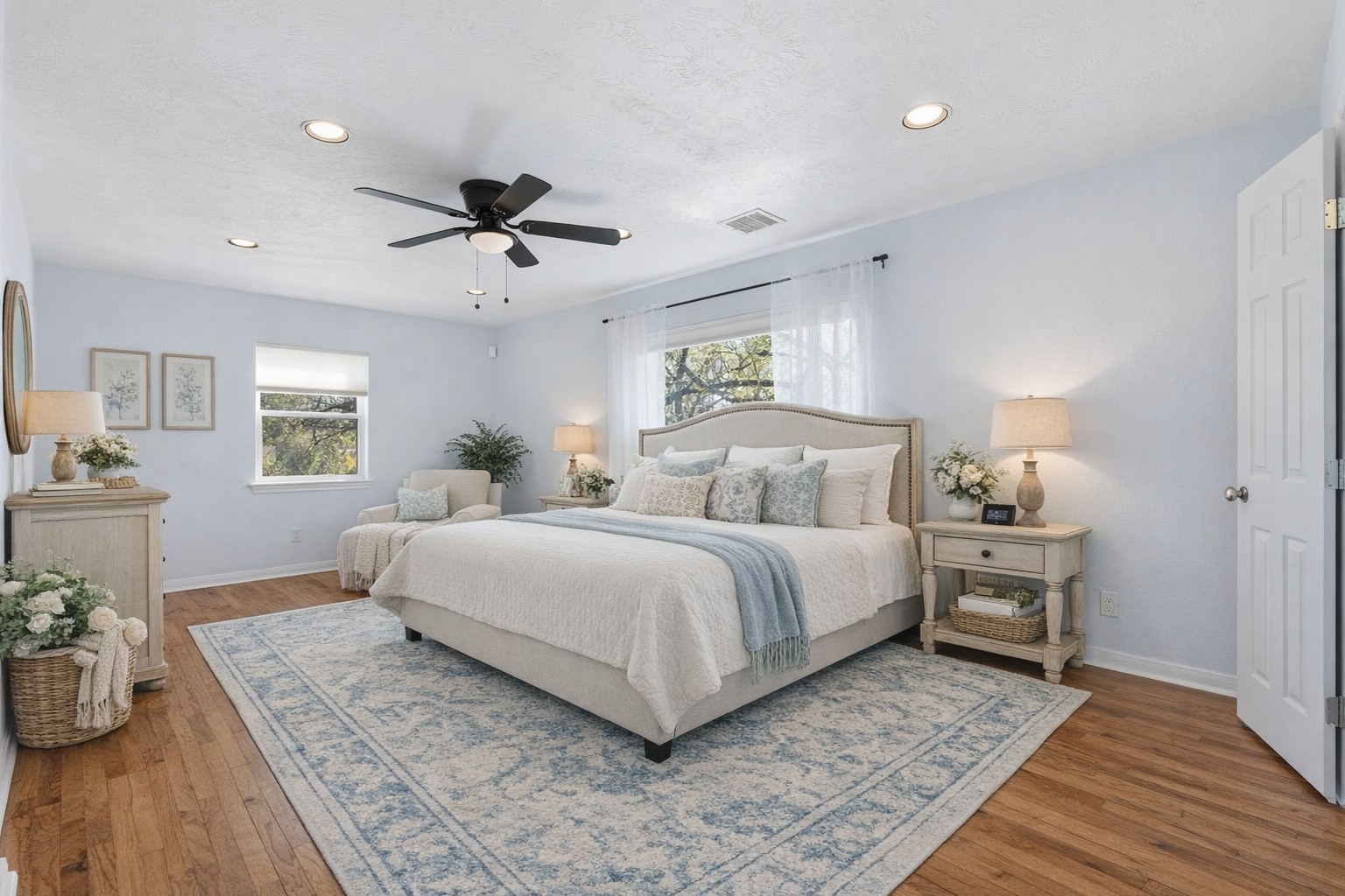 180 Grove Road Kemah, TX 77565 - Photo 15 of 30 This spacious primary bedroom on the main floor offers a serene retreat with elegant decor and abundant natural light.