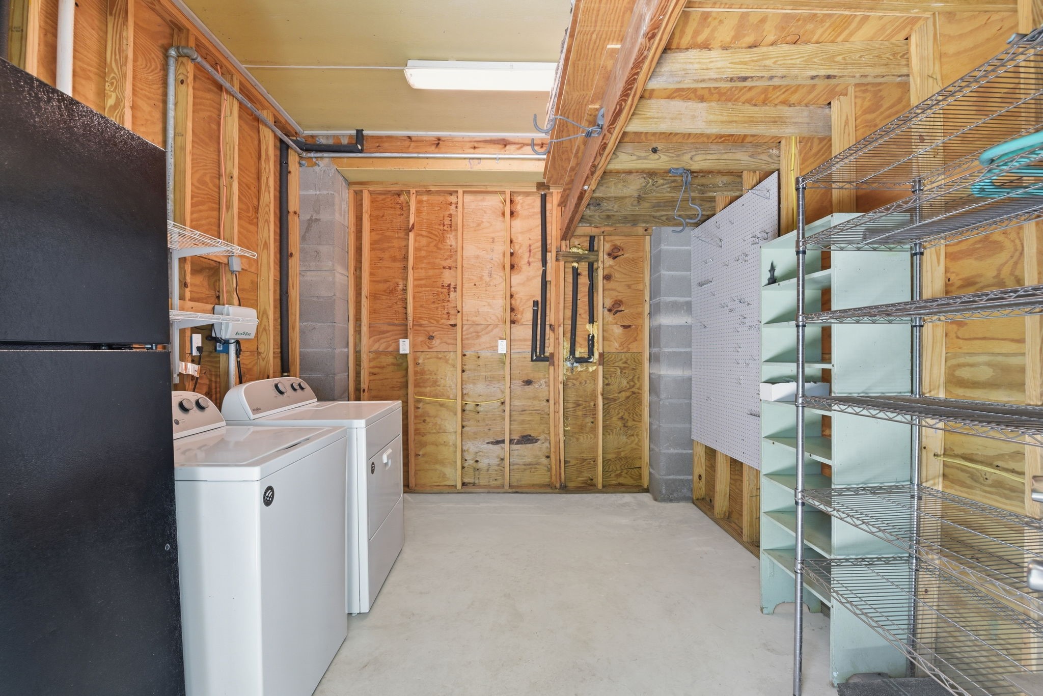 180 Grove Road Kemah, TX 77565 - Photo 27 of 30 The Utility room is located seperately from the main house and has an extra beverage refrigerator.