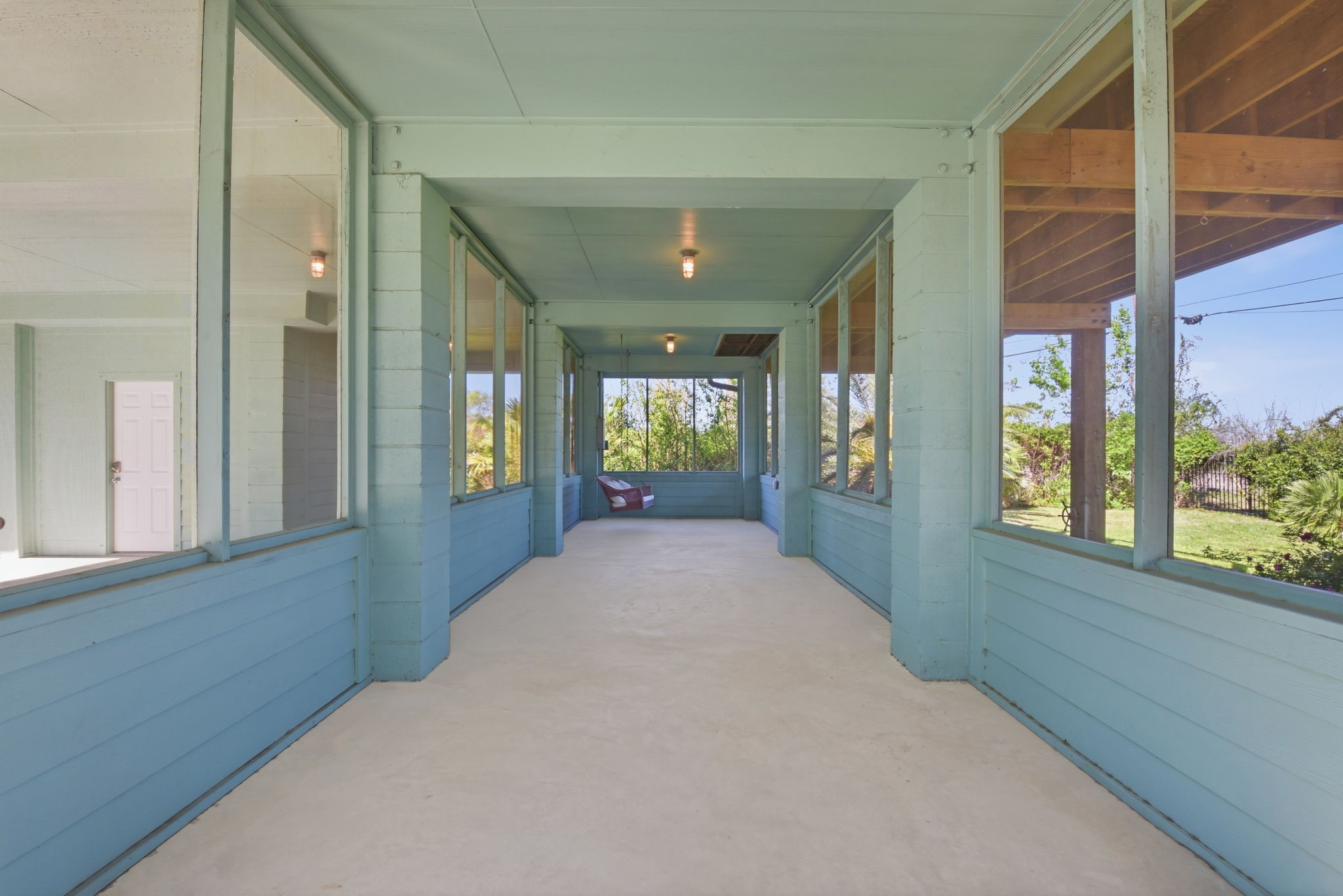 180 Grove Road Kemah, TX 77565 - Photo 29 of 30 Unstaged Sunroom has a nice relaxing swing included.