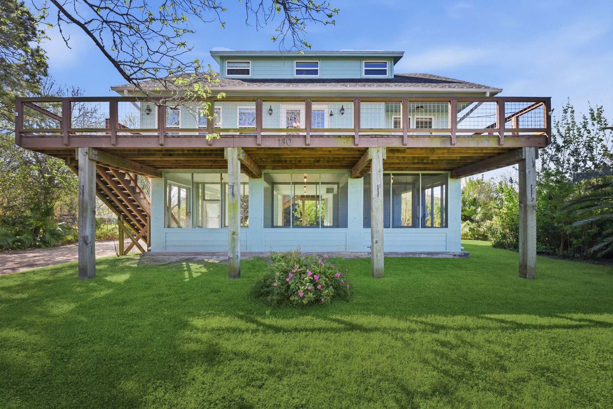 180 Grove Road Kemah, TX 77565 - Photo 3 of 30 This charming home offers a delightful blend of outdoor spaces with a front and back porch, plus an added cozy screened-in porch.