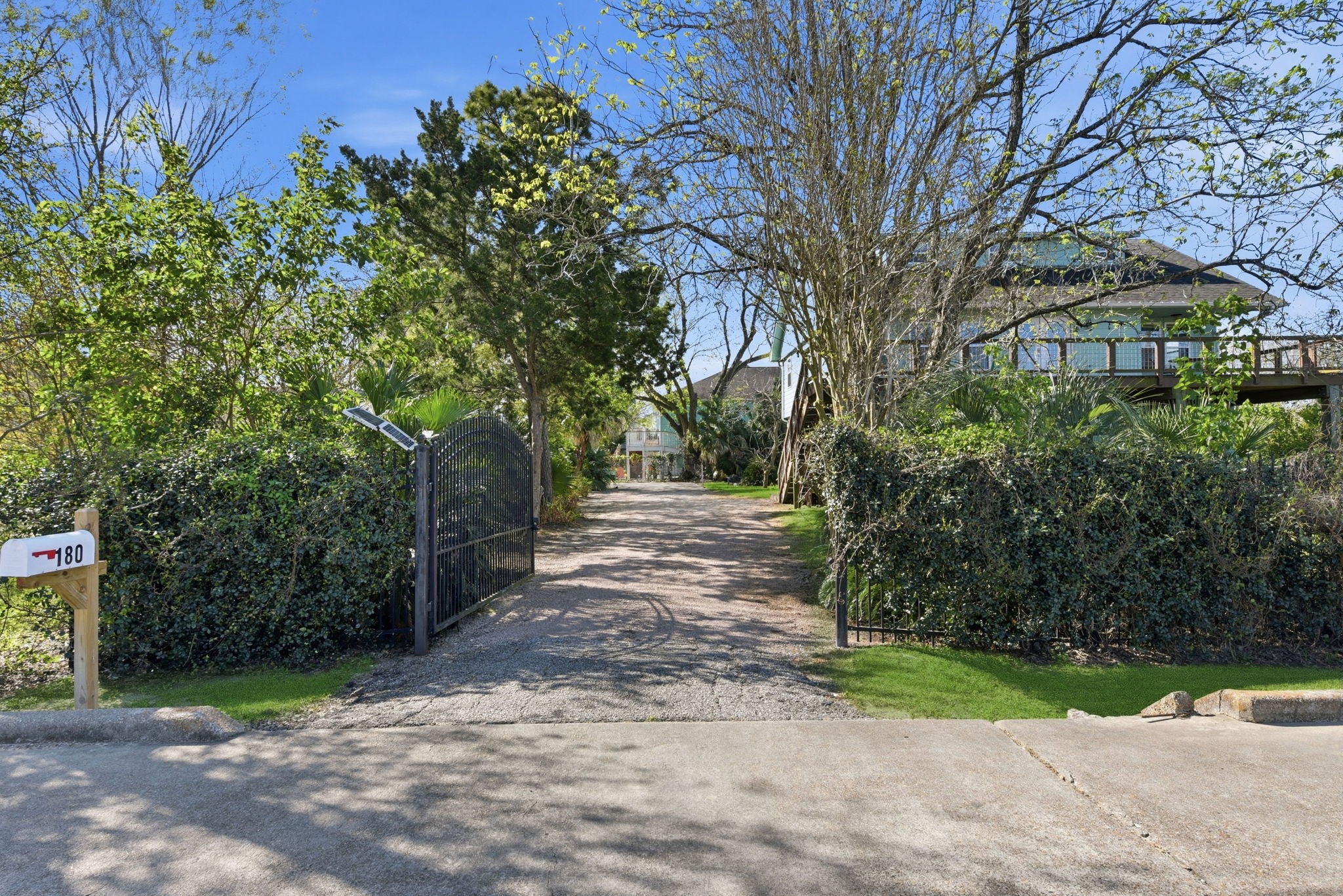 180 Grove Road Kemah, TX 77565 - Photo 4 of 30 Experience the perfect blend of privacy and convenience with this home, featuring a welcoming automatic gate that sets the tone for a secure and serene living environment.
