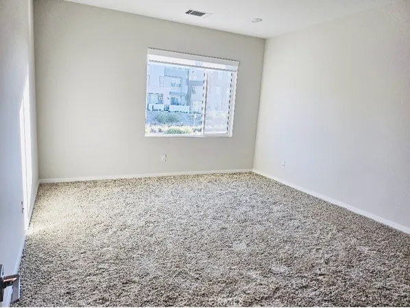 an empty room with a bench