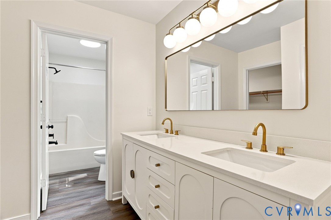 2549 Retrievers Ridge Road Henrico, VA 23233 - Photo 28 of 47 Dual sink vanity with gold-finish fixtures and whi