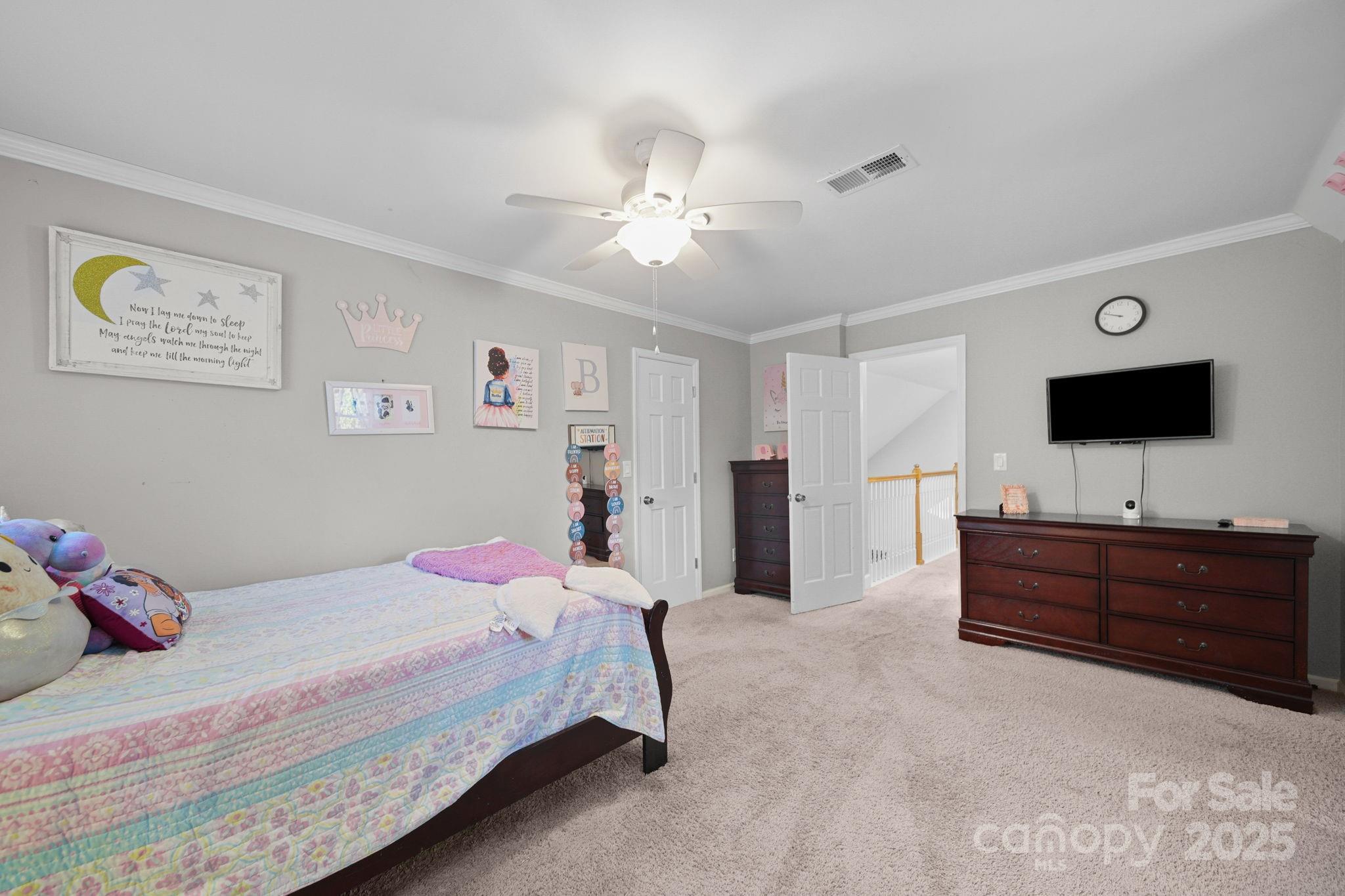 4724 Weddington Matthews Road Matthews, NC 28104 - Photo 21 of 42 a bedroom with a bed and flat screen tv
