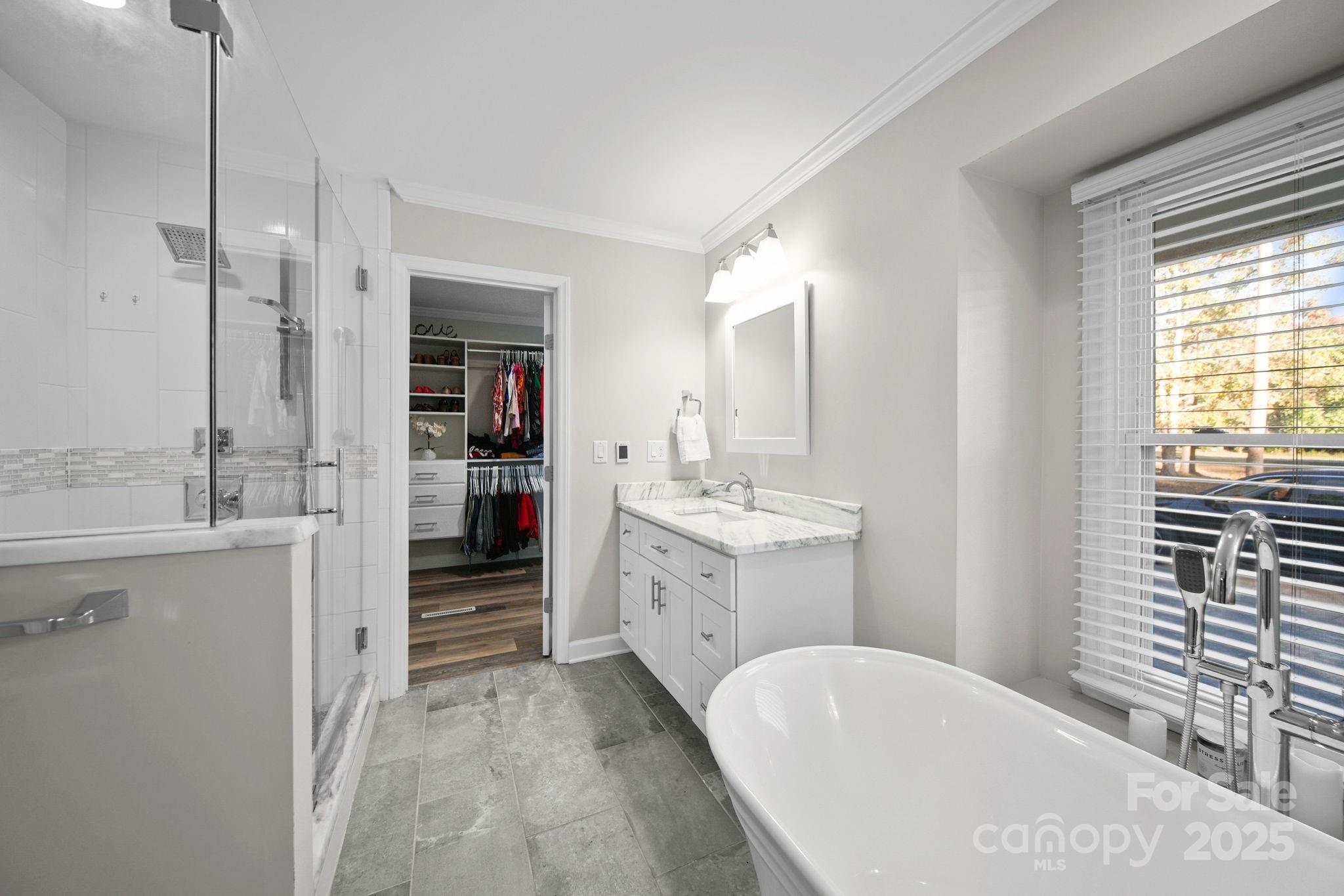 4724 Weddington Matthews Road Matthews, NC 28104 - Photo 30 of 42 a bathroom with a granite countertop sink mirror and a bathtub