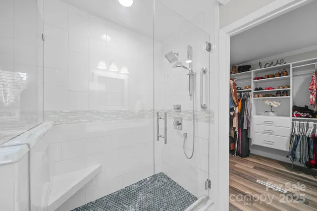 a bathroom with a double vanity sink a mirror and a toilet