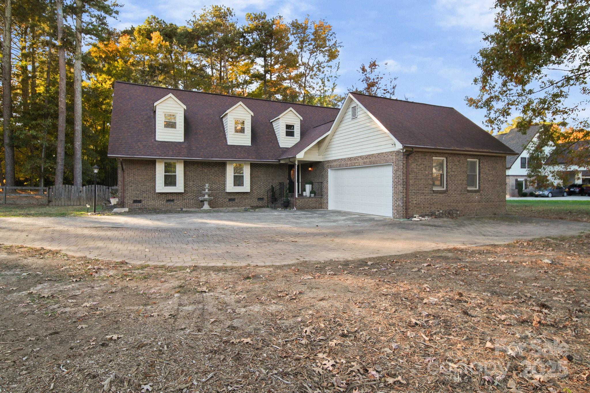 4724 Weddington Matthews Road Matthews, NC 28104 - Photo 41 of 42 a front view of a house with a yard