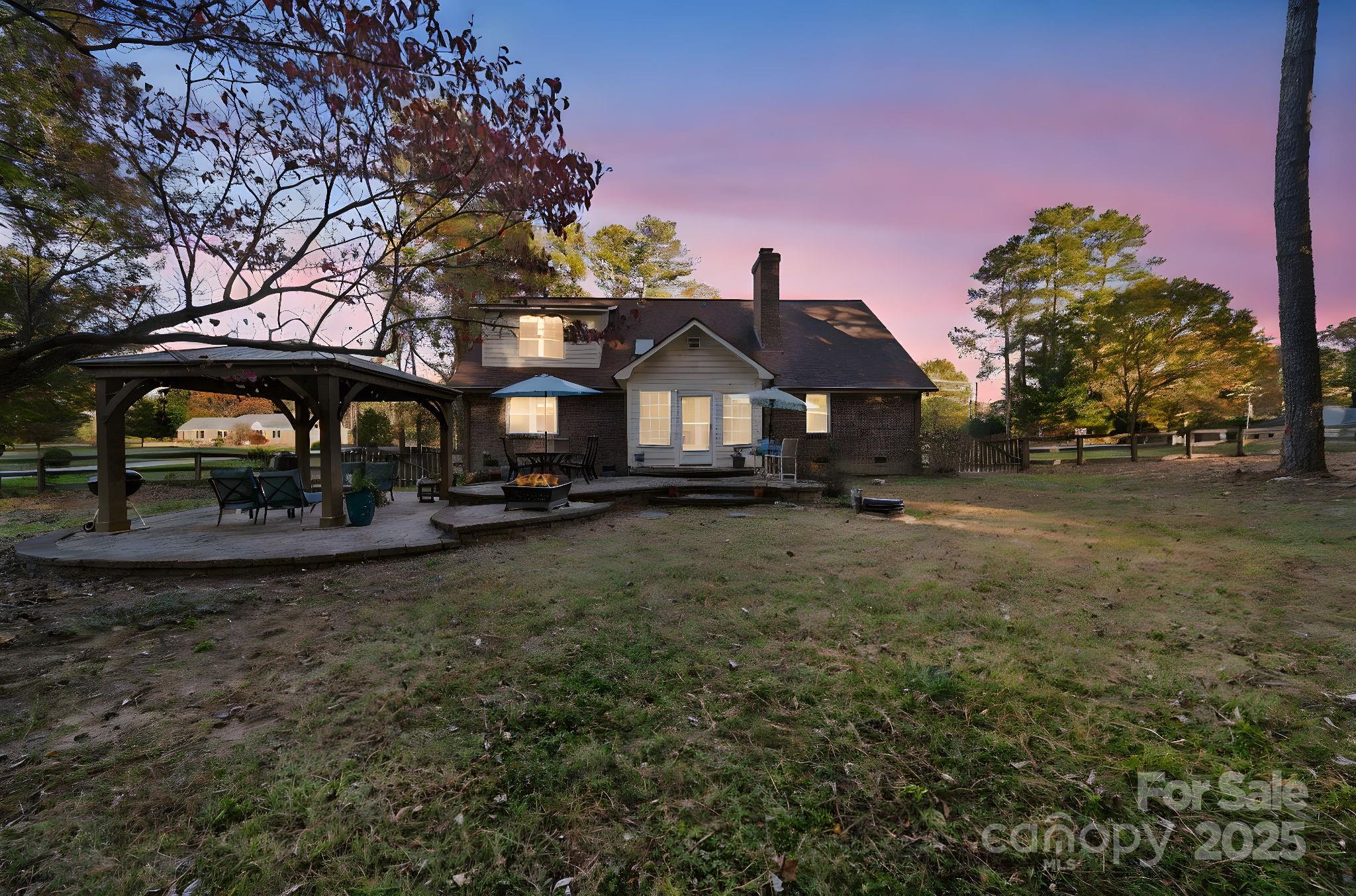 4724 Weddington Matthews Road Matthews, NC 28104 - Photo 42 of 42 a front view of a house with garden