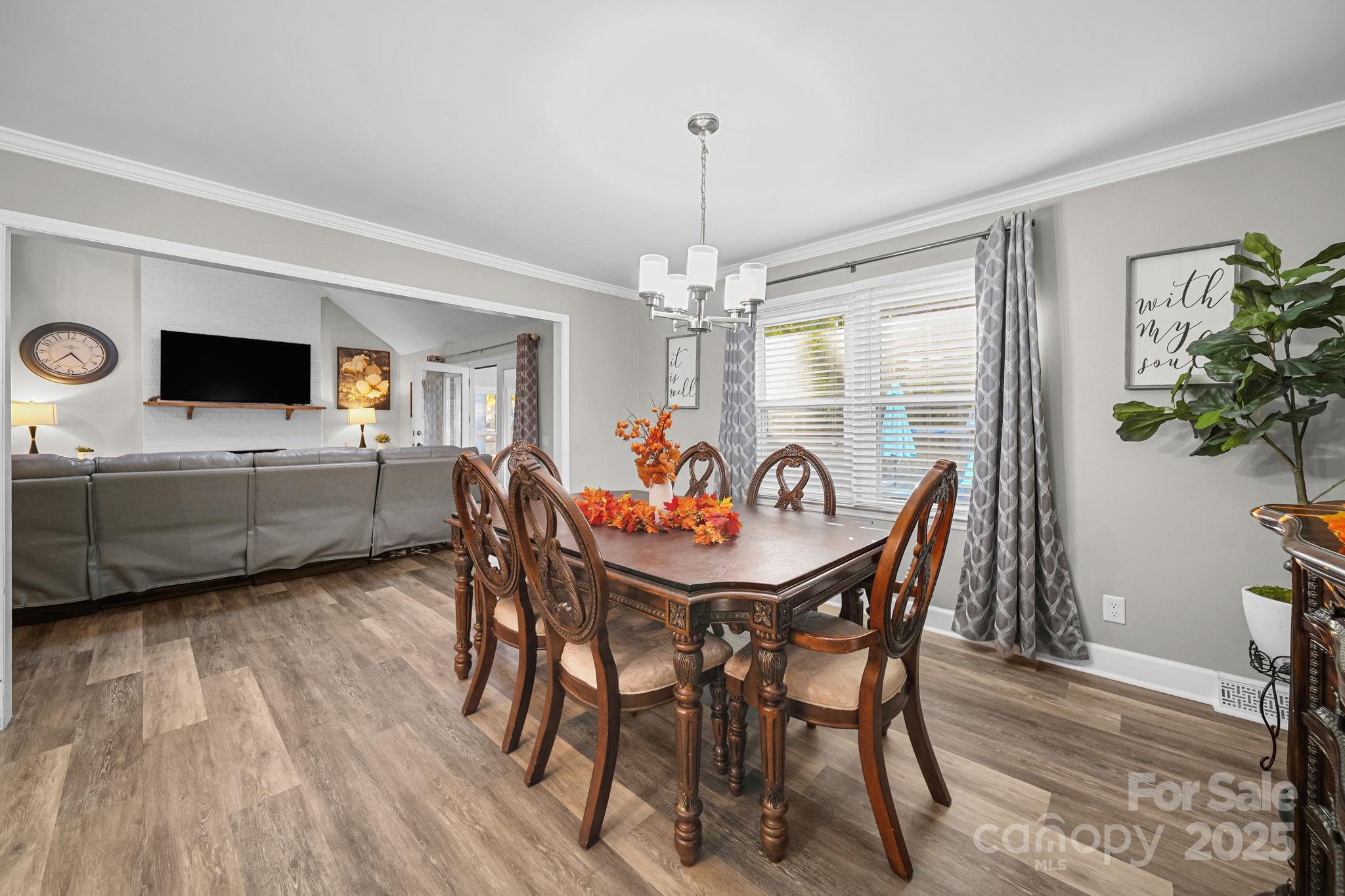 4724 Weddington Matthews Road Matthews, NC 28104 - Photo 6 of 42 a view of a dining room with furniture window and wooden floor