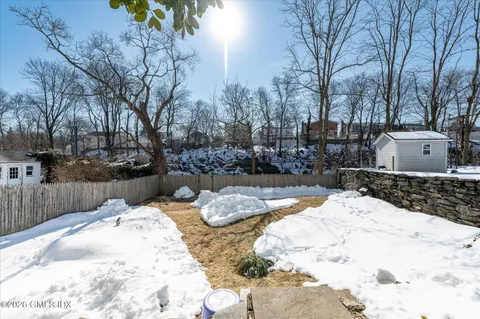 a view of a backyard of snow