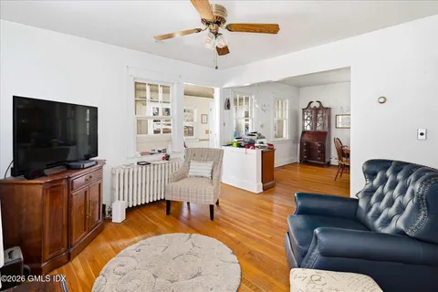 a living room with furniture and a flat screen tv