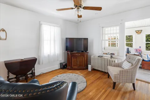 a living room with furniture and a flat screen tv