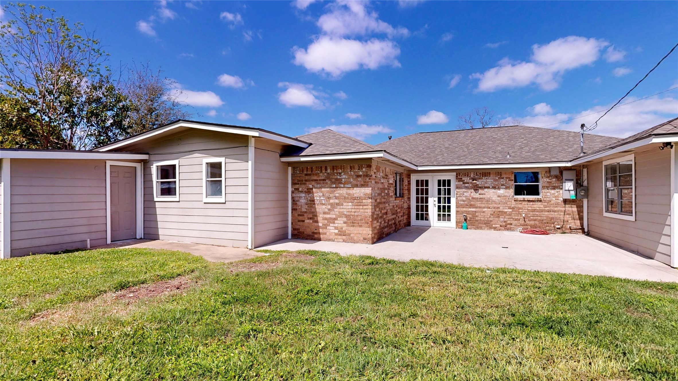 4914 29th Street Dickinson, TX 77539 - Photo 25 of 28 View of Back Yard. To Your Left is a Storage Room with the Water Heater. Perfect space to store extra patio Furniture or yard equiptment.