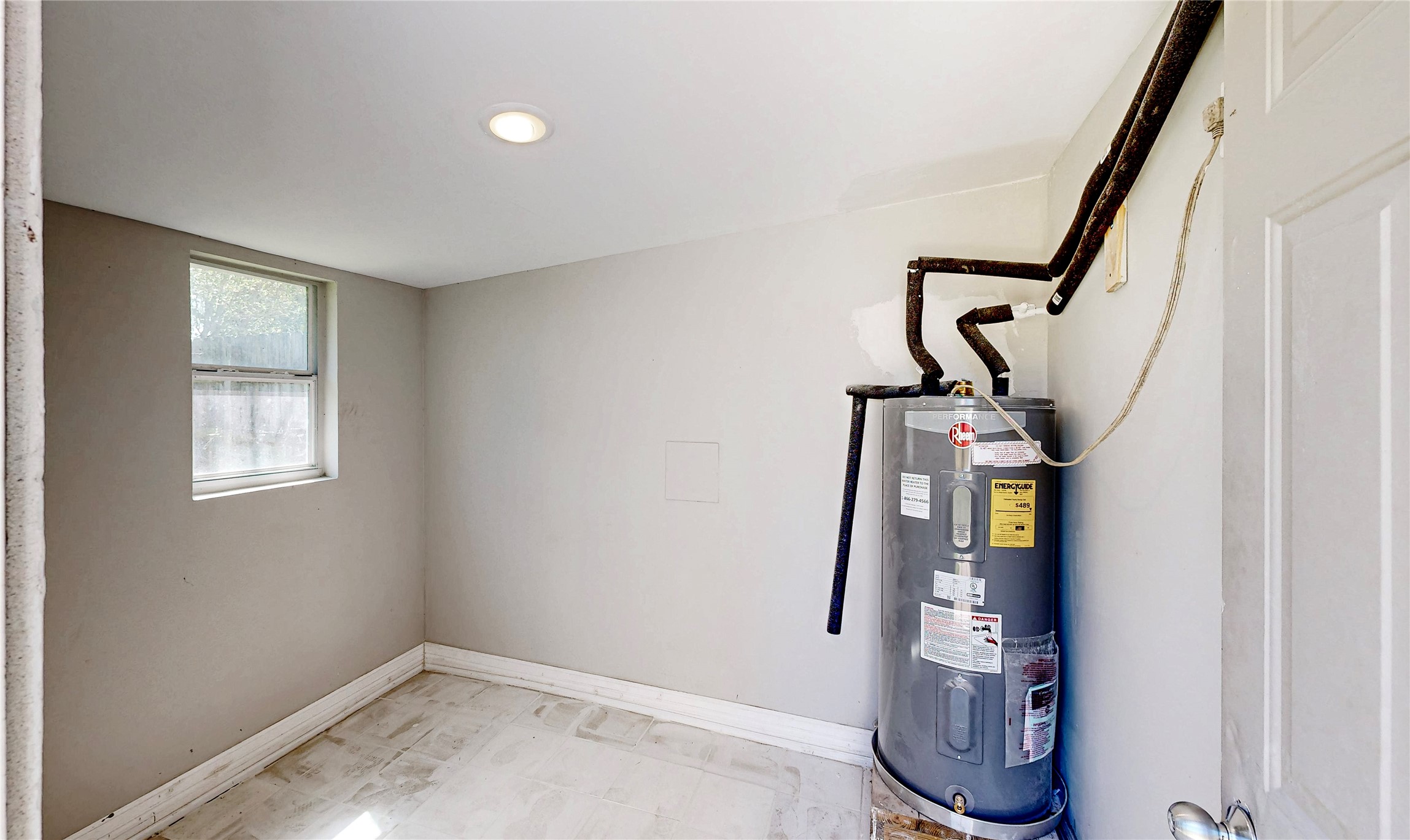 4914 29th Street Dickinson, TX 77539 - Photo 26 of 28 Storeage Room with Water Heater. Good Extra Space.