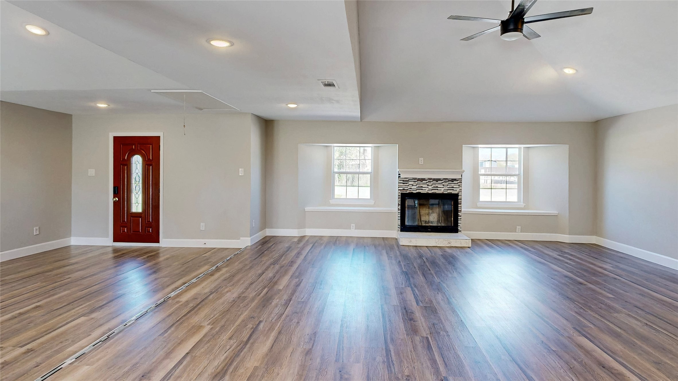 4914 29th Street Dickinson, TX 77539 - Photo 8 of 28 Open Concept Living. Beautiful Red Wood Door. Wood Burning Fireplace.