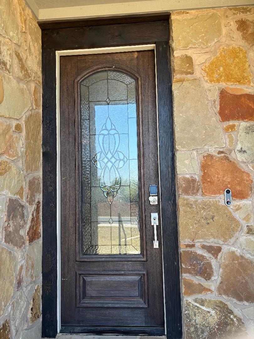 Undisclosed Address Dripping Springs, TX 78620 - Photo 2 of 19 Property entrance featuring stone siding