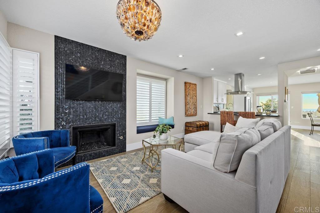 6939 Carnation Drive Carlsbad, CA 92011 - Photo 3 of 13 a living room with furniture and a fireplace