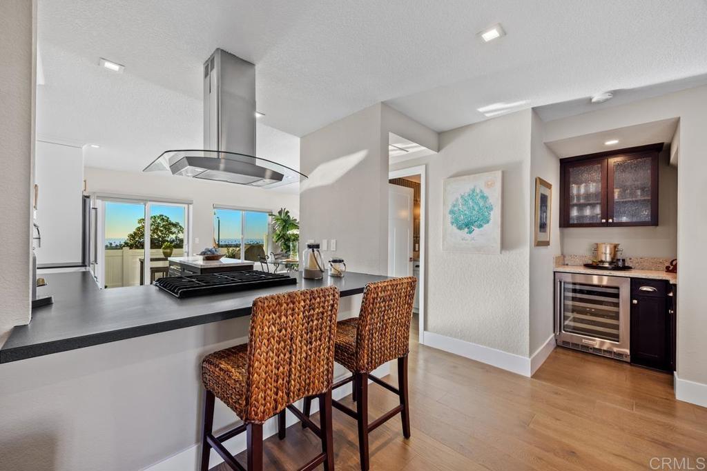 6939 Carnation Drive Carlsbad, CA 92011 - Photo 4 of 13 a living room with furniture and a flat screen tv