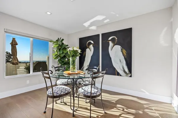 a view of a dining room with furniture and window