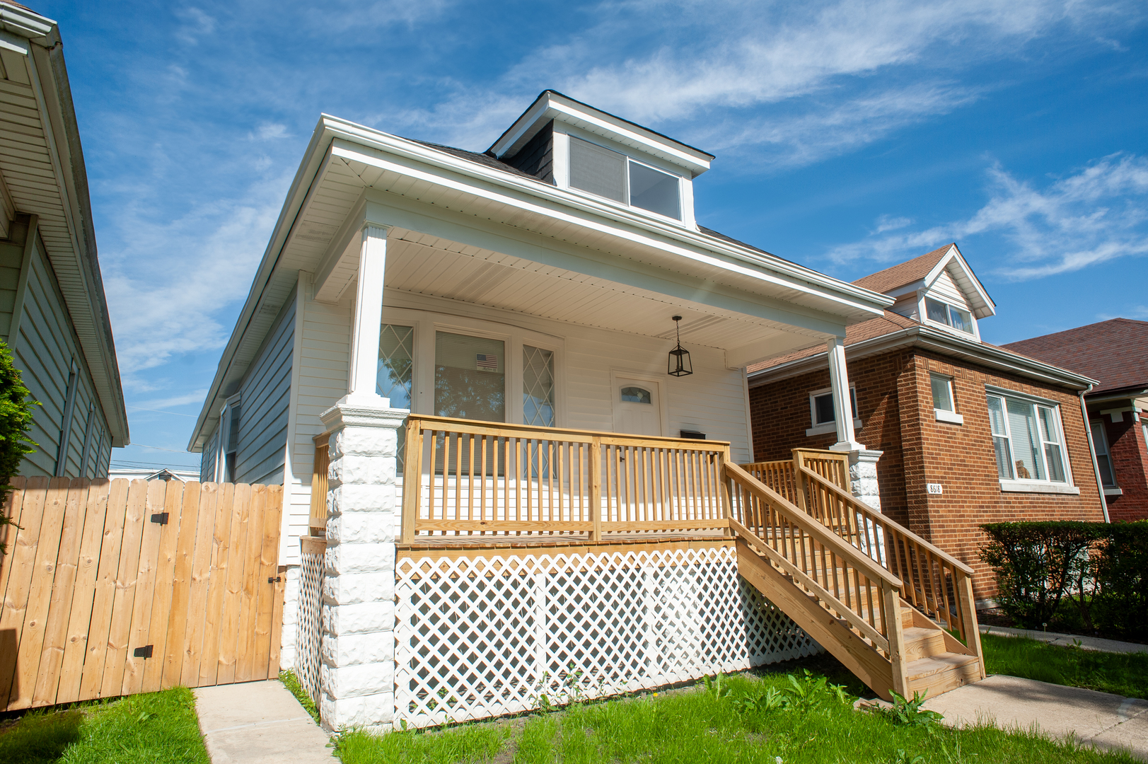 8620 South Union Avenue Chicago, IL 60620 - Photo 3 of 41 a view of a house with a wooden deck