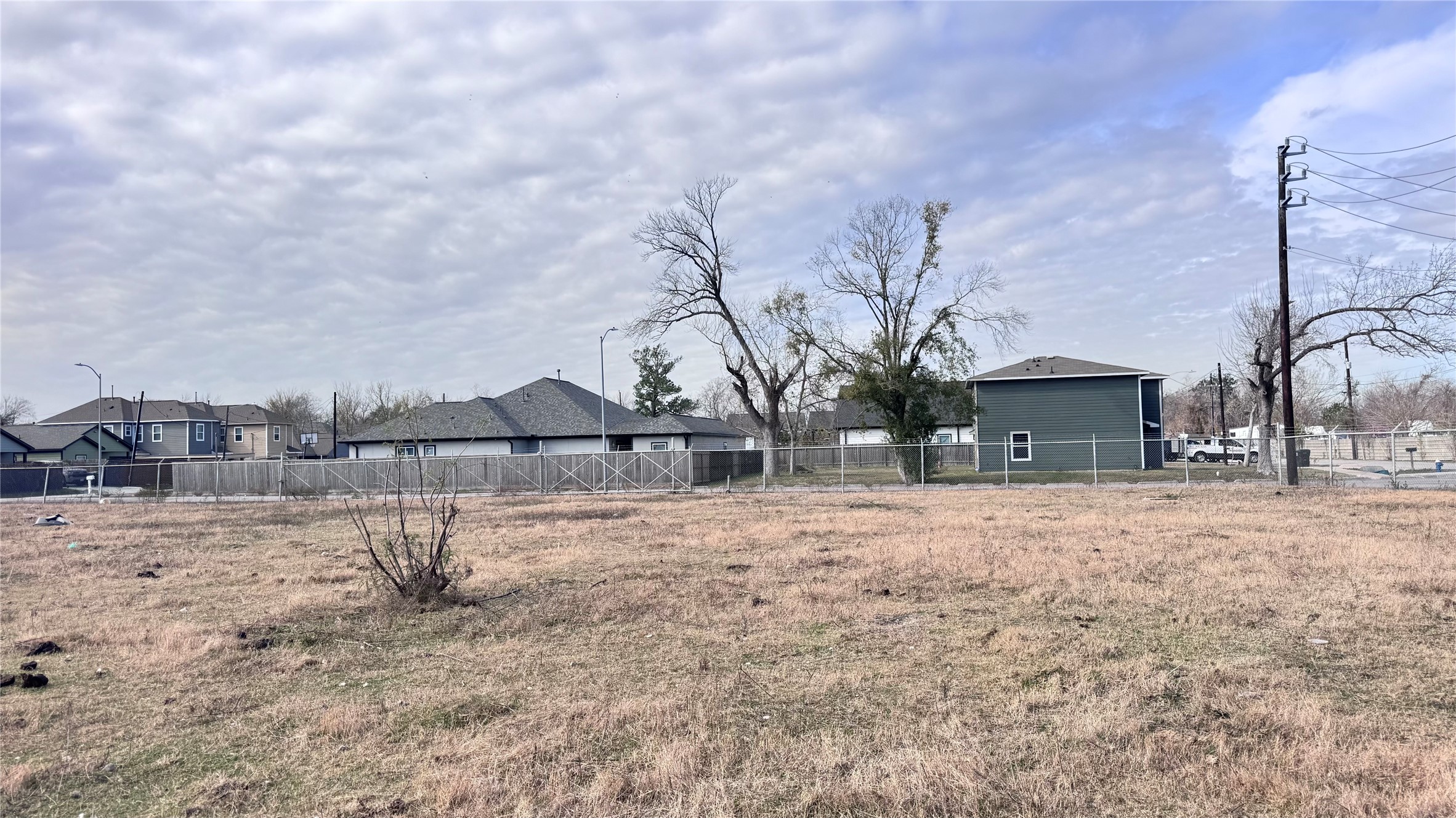 6409 Haight Street Houston, TX 77028 - Photo 10 of 12 a front view of a house with a yard and covered with snow
