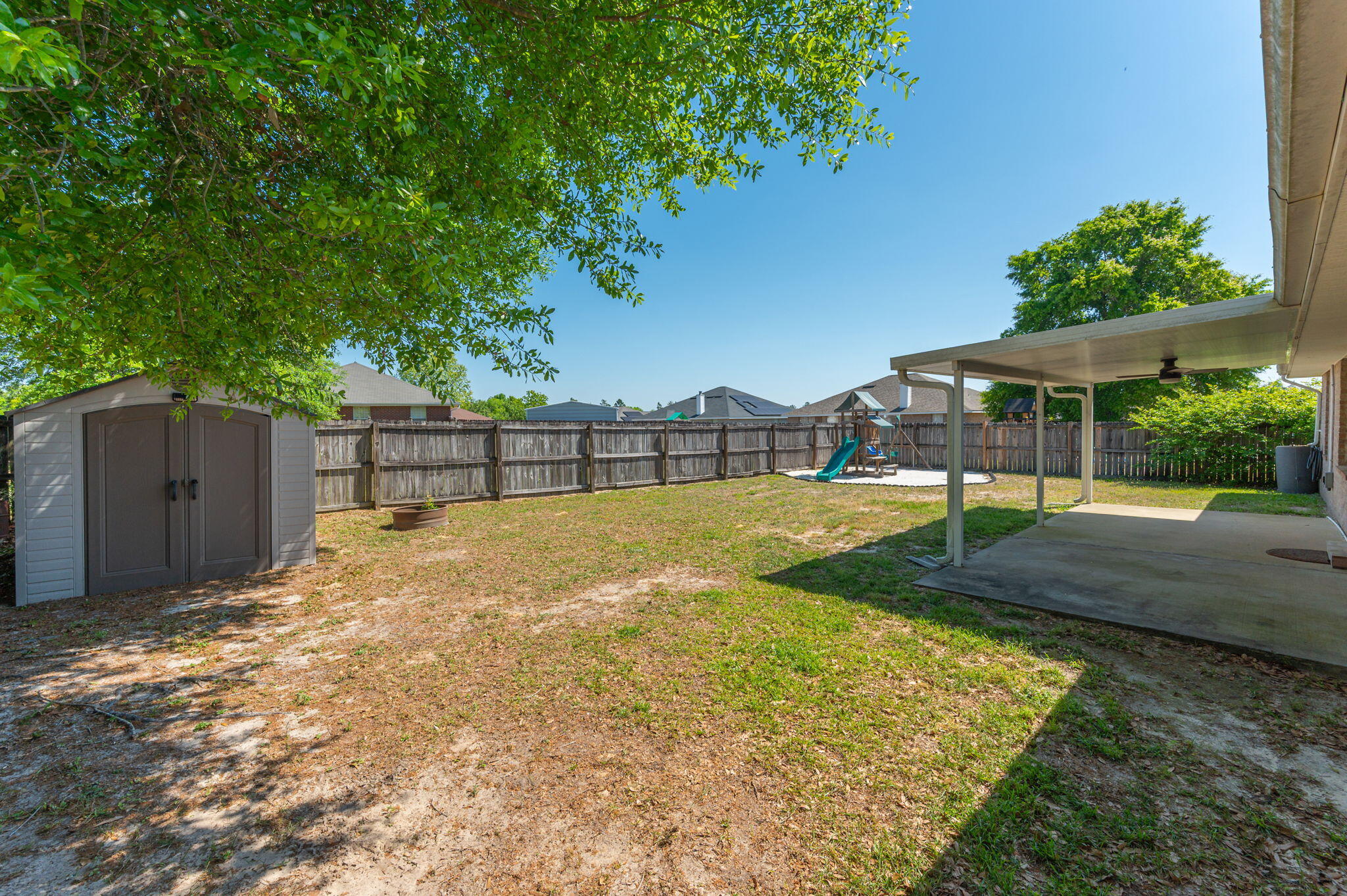 208 Citadel Lane Crestview, FL 32539 - Photo 11 of 27 a view of backyard with wooden fence