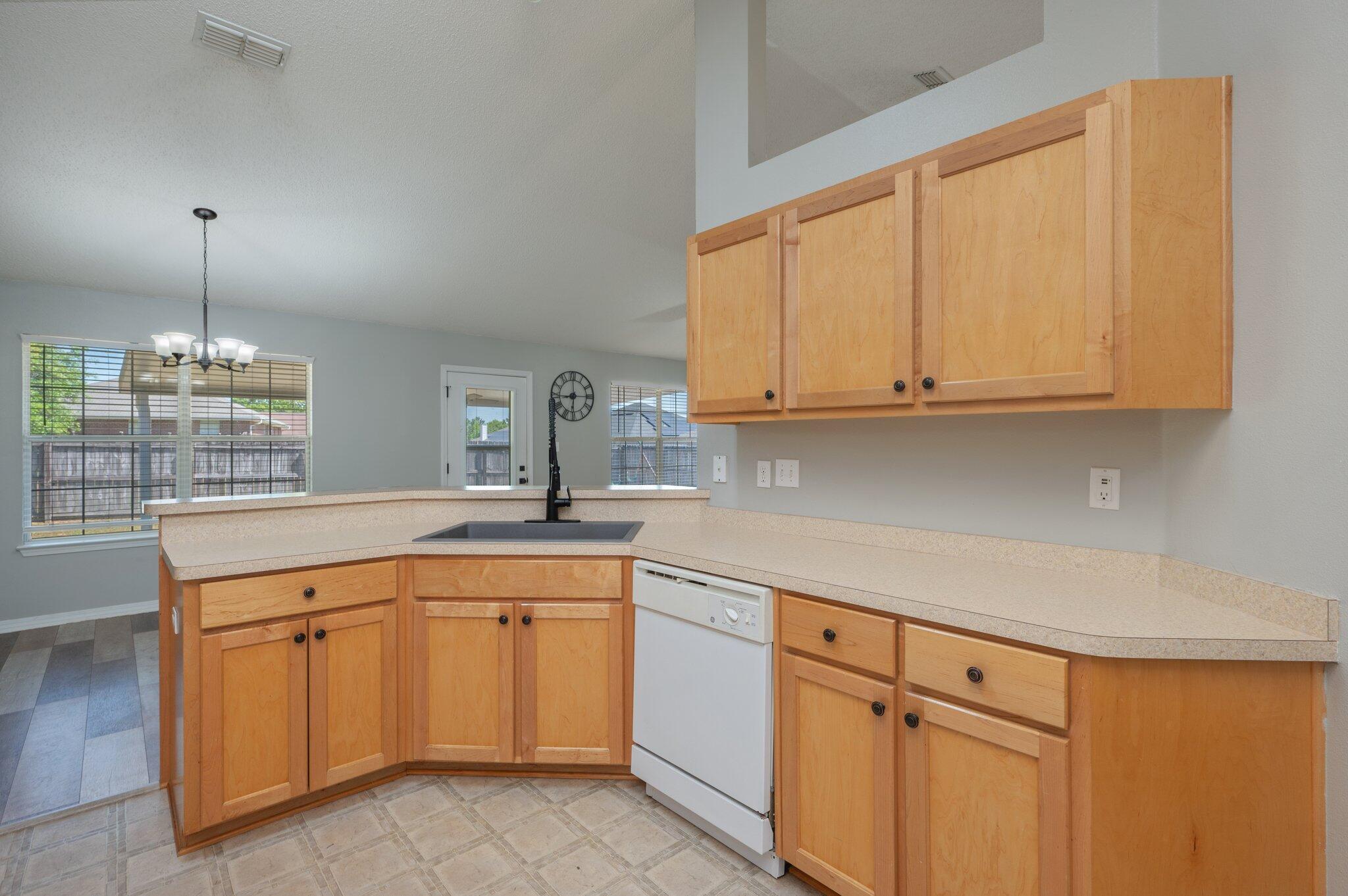 208 Citadel Lane Crestview, FL 32539 - Photo 20 of 27 a kitchen with white cabinets and white appliances
