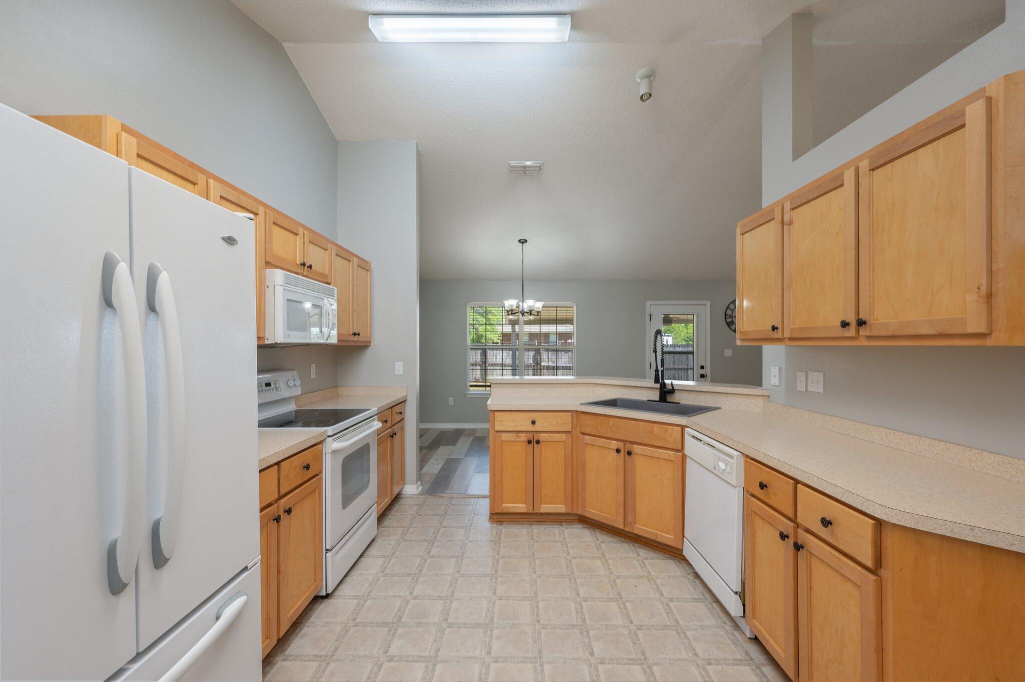 208 Citadel Lane Crestview, FL 32539 - Photo 3 of 27 a kitchen with stainless steel appliances granite countertop a sink and cabinets