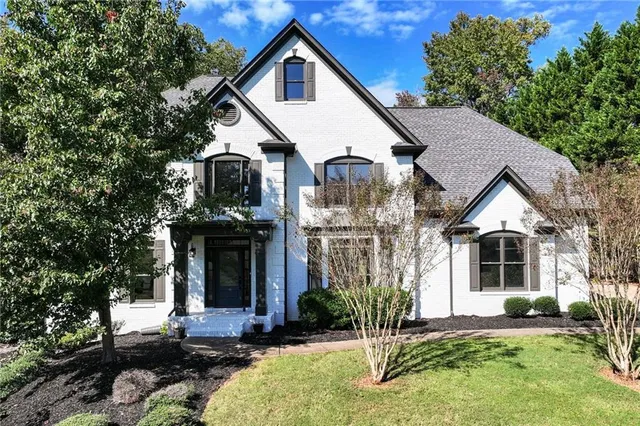 a front view of a house with a yard