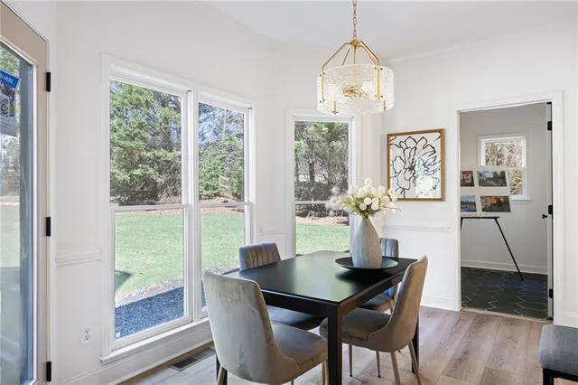 a dining room with furniture window wooden floor