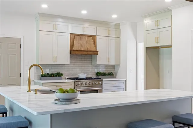 a kitchen with a sink a counter space and cabinets
