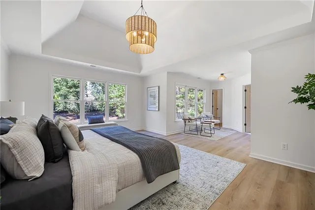 a dining room with furniture and a window