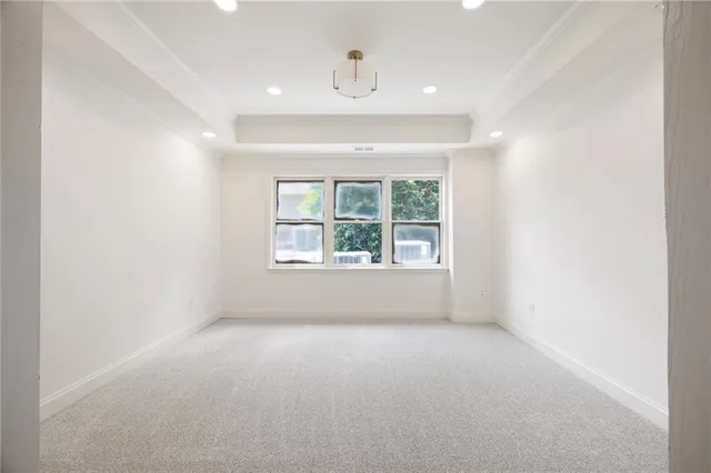 a view of balcony with wooden floor and fence